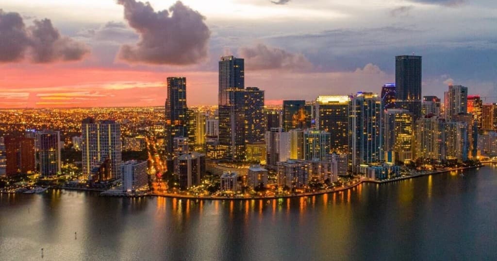 The Brickell and downtown Miami skyline at dusk — home of Giraldo Associates